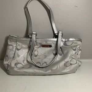 Women’s silver Coach bag